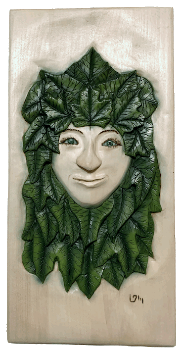 Green man, spirit face, wood carving, garden art